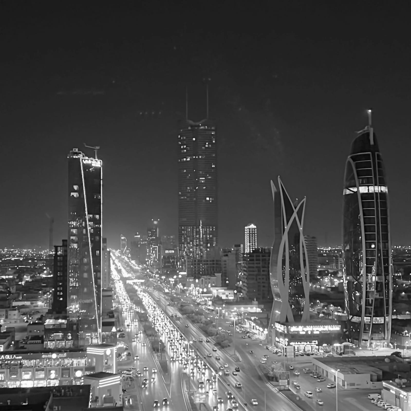 A lit city skyline at night, seen from above