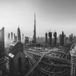 A multi-level interchange curving through Dubai after dark